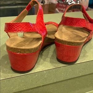 Vionic red sandals with wedge heel.